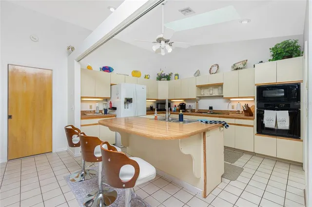 a kitchen with stainless steel appliances granite countertop a sink and cabinets