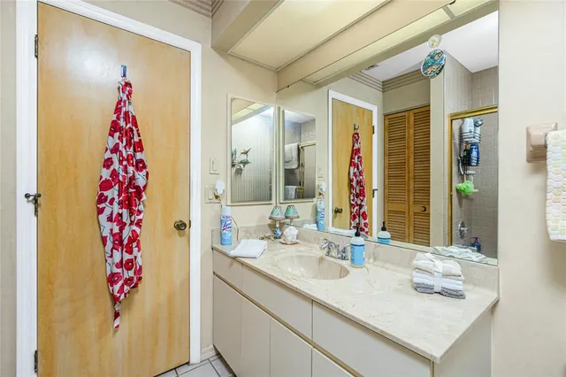 a bathroom with a sink vanity and a mirror
