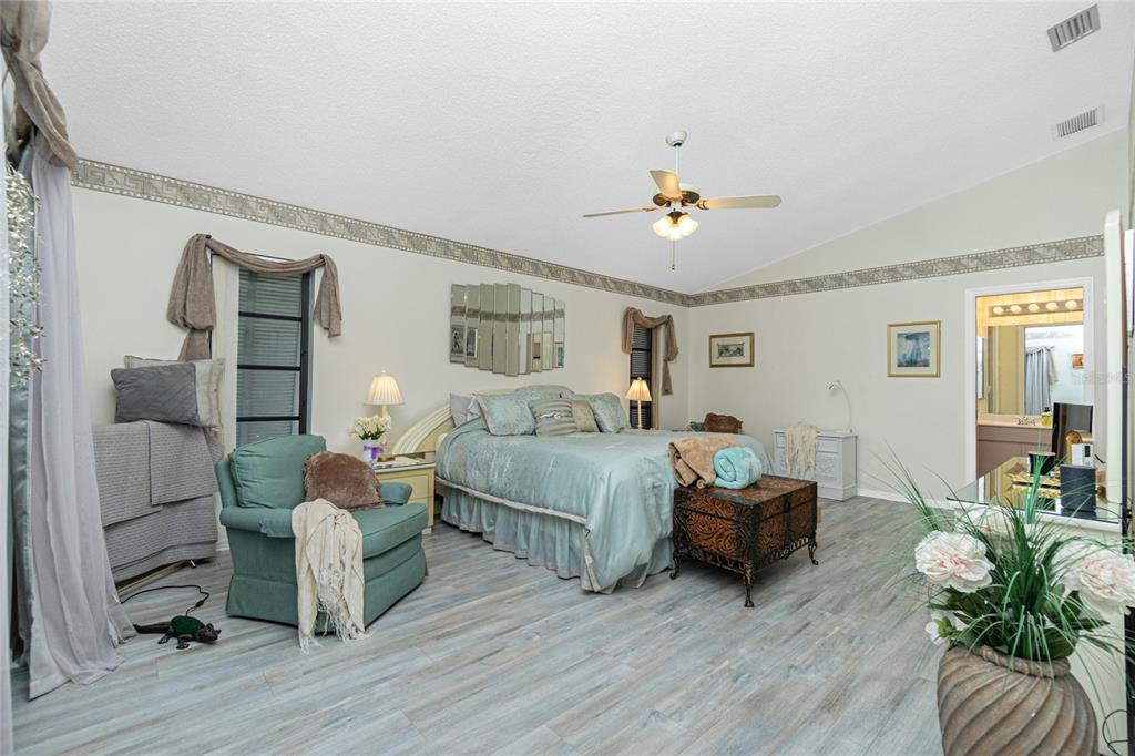 204 Bunker Road Rotonda West, FL 33947 - Photo 27 of 49 a bedroom with furniture and wooden floor