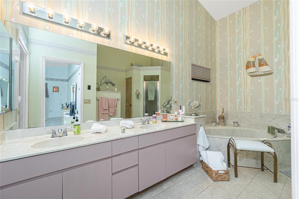 204 Bunker Road Rotonda West, FL 33947 - Photo 30 of 49 a bathroom with a double vanity sink mirror and double