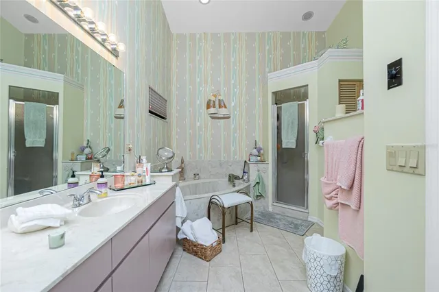 a bathroom with a double vanity sink and a mirror