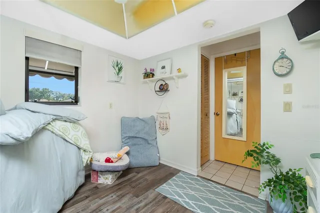 a dining room with furniture water view and a floor to ceiling window