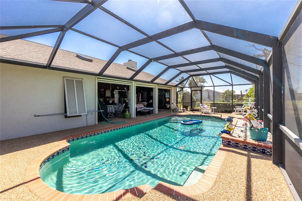 204 Bunker Road Rotonda West, FL 33947 - Photo 38 of 49 a view of a porch with furniture and a backyard