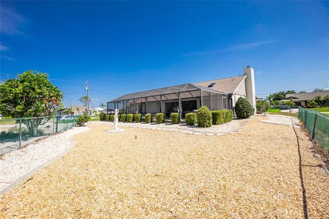 a view of a house with a yard and garage