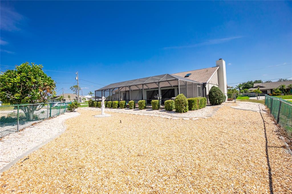 204 Bunker Road Rotonda West, FL 33947 - Photo 39 of 49 a view of a house with a yard