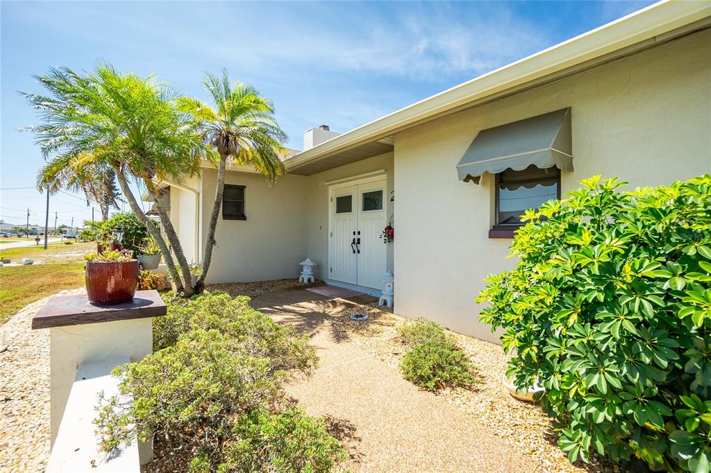 204 Bunker Road Rotonda West, FL 33947 - Photo 43 of 49 a front view of a house with garden