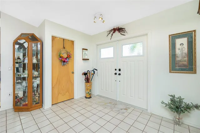 a view of an entryway with wooden floor