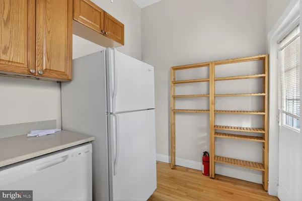 a view of cabinets and wooden floor