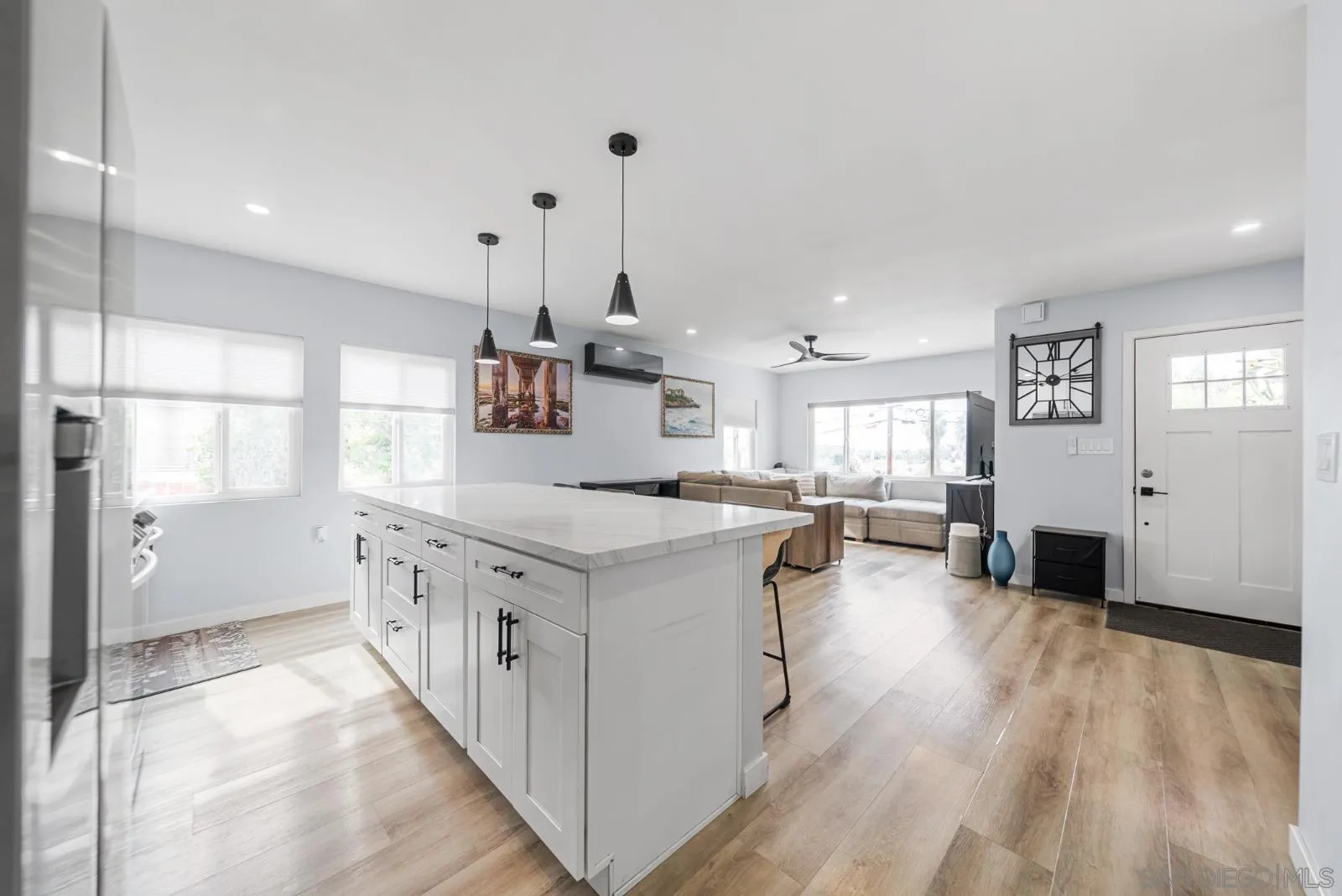 4001 North Bonita Street Spring Valley, CA 91977 - Photo 2 of 31 a kitchen with stainless steel appliances granite countertop a lot of counter space and wooden floors