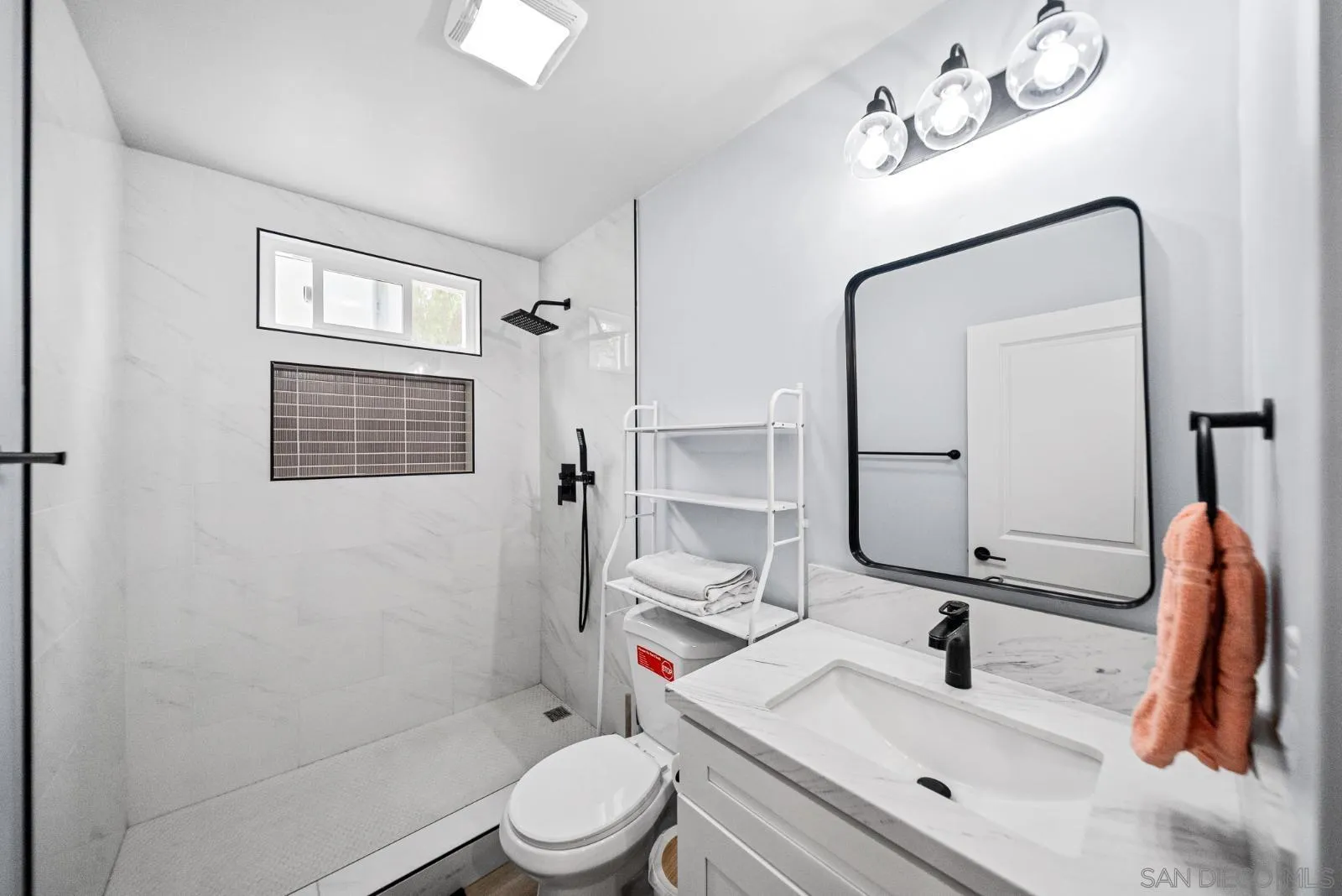 4001 North Bonita Street Spring Valley, CA 91977 - Photo 3 of 31 a bathroom with a sink vanity granite toilet tub and shower