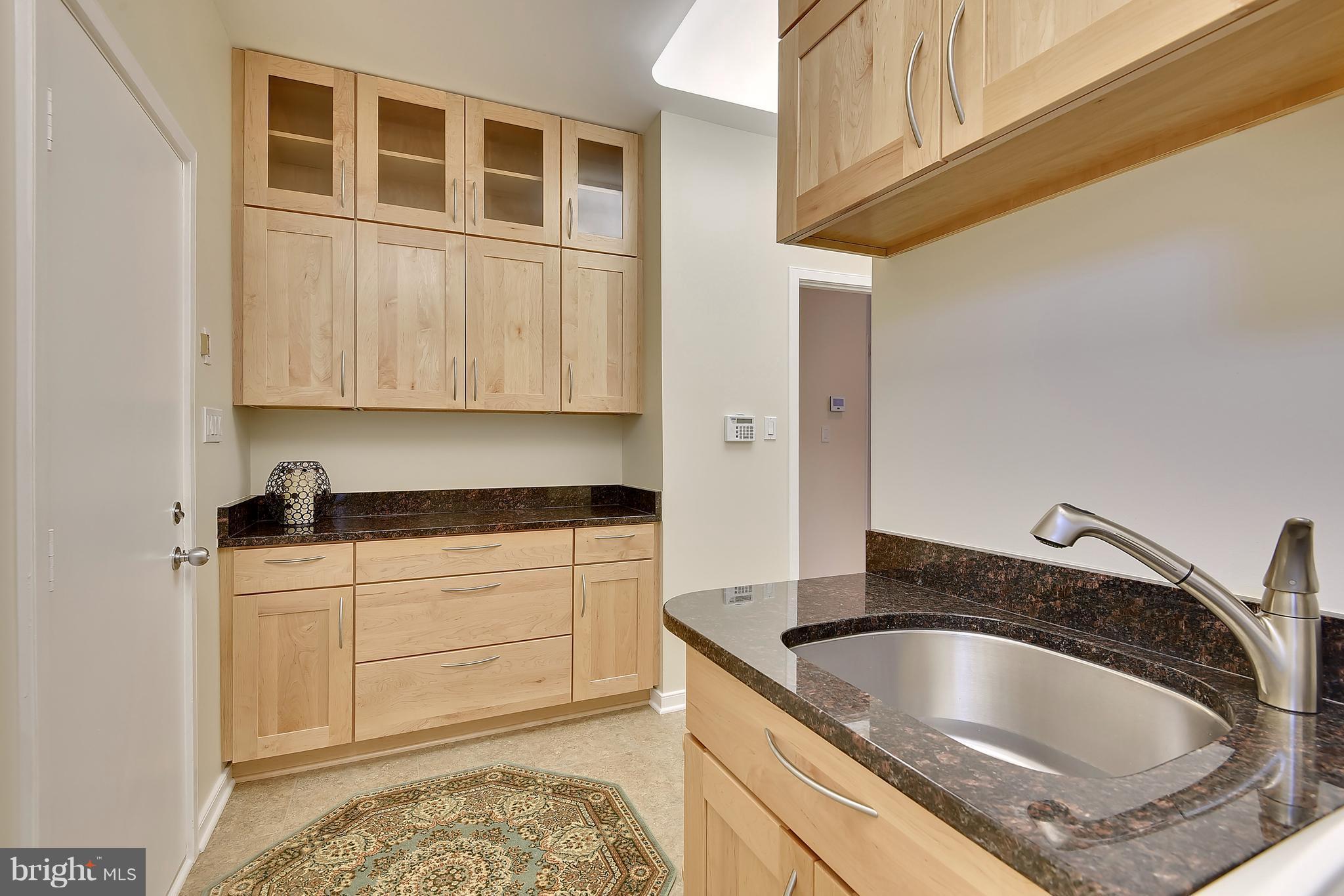 1486 Waterfront Road Reston, VA 20194 - Photo 14 of 30 Laundry Room with Maple Cabinets & Granite