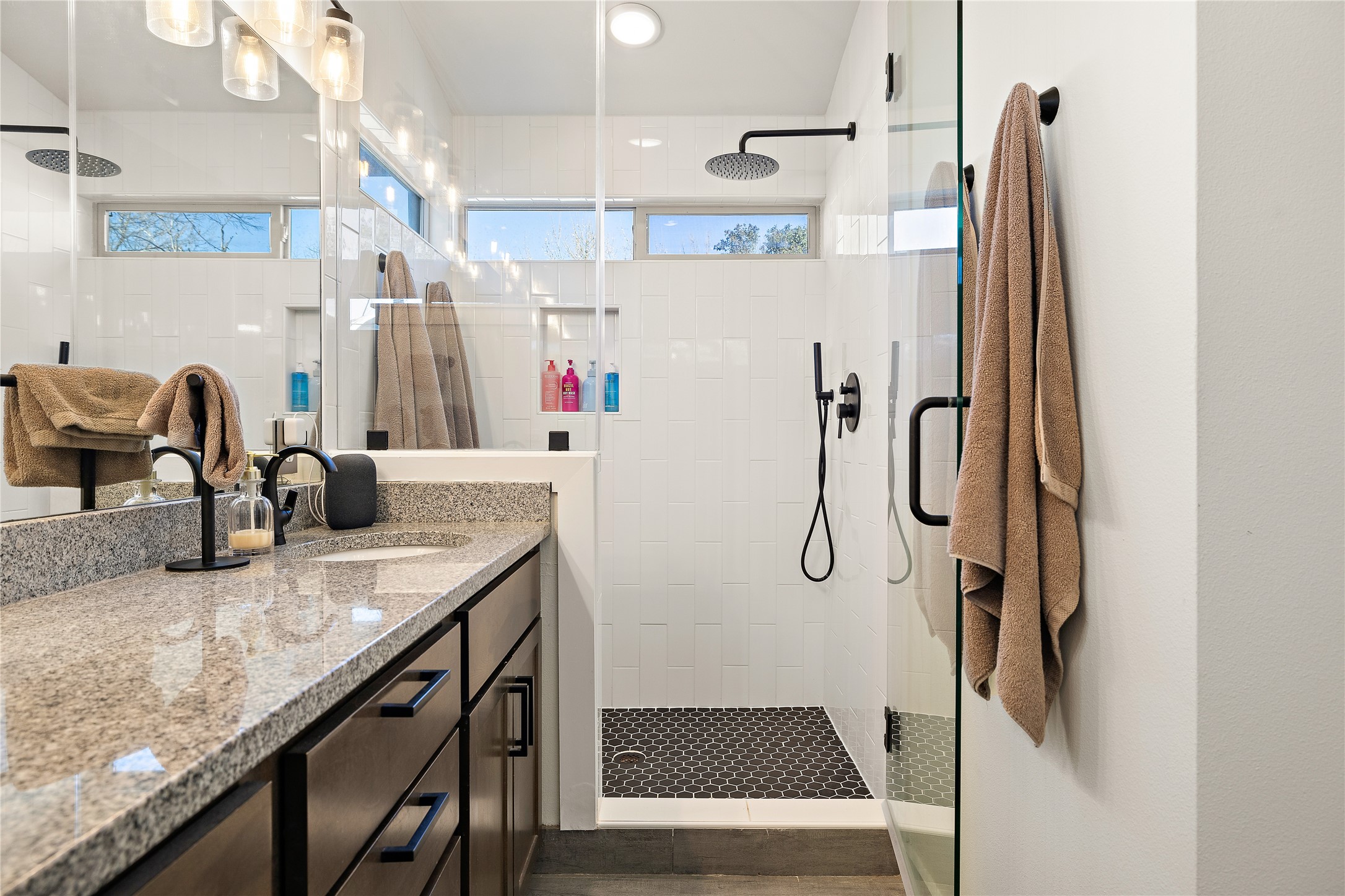 1402 Singleton Avenue, Unit B Austin, TX 78702 - Photo 15 of 25 Re-tiled glass shower with waterfall shower head