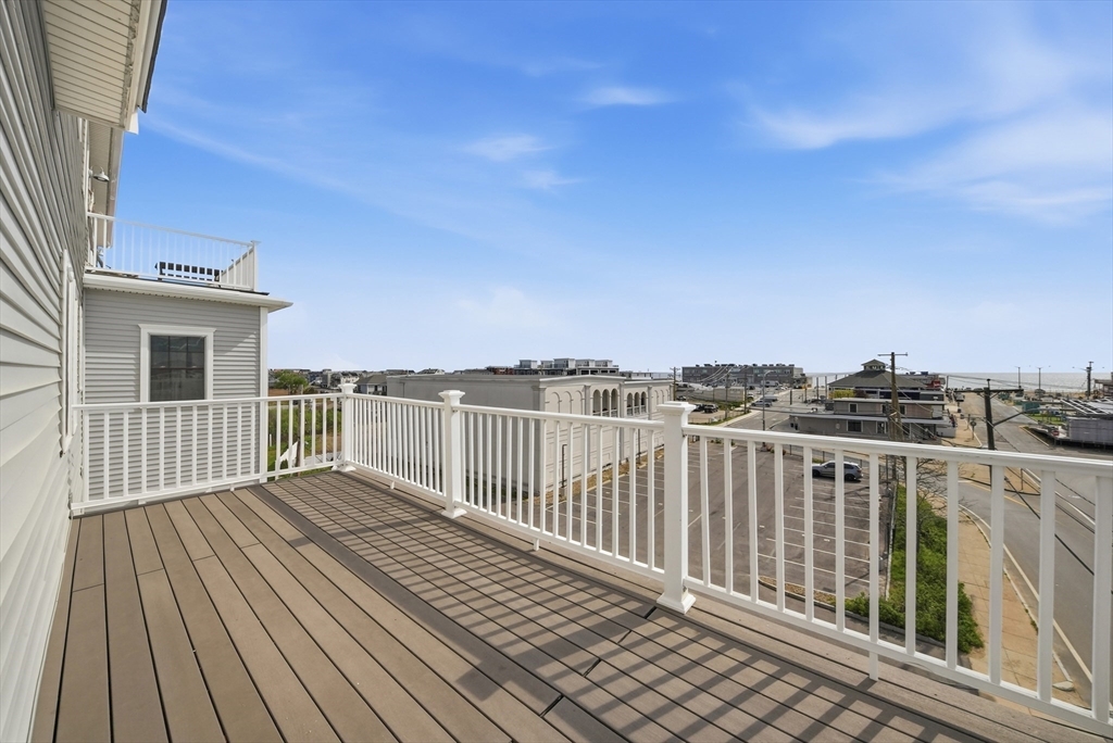 233 Beach Road, Unit A11 Salisbury, MA 01952 - Photo 32 of 37 a view of a balcony with wooden floor