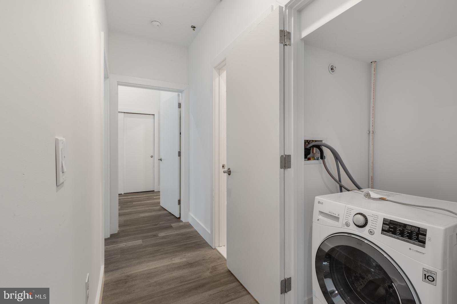 2559 Amber Street, Unit 101 Philadelphia, PA 19125 - Photo 11 of 35 a view of a hallway with washer and dryer