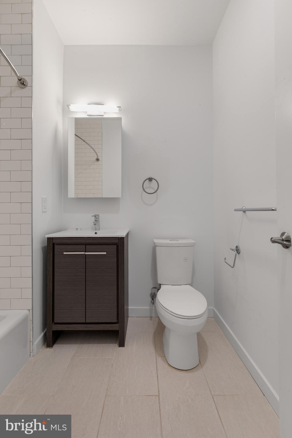 2559 Amber Street, Unit 101 Philadelphia, PA 19125 - Photo 18 of 35 a bathroom with a toilet and a sink