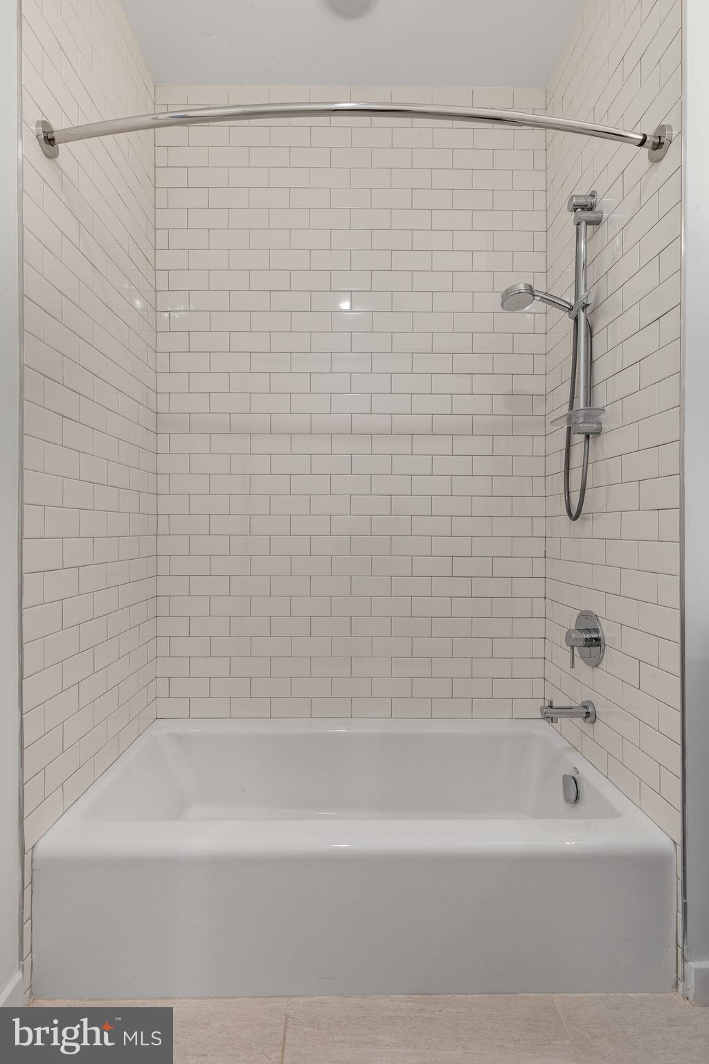2559 Amber Street, Unit 101 Philadelphia, PA 19125 - Photo 20 of 35 a bathroom with a shower and a bath tub