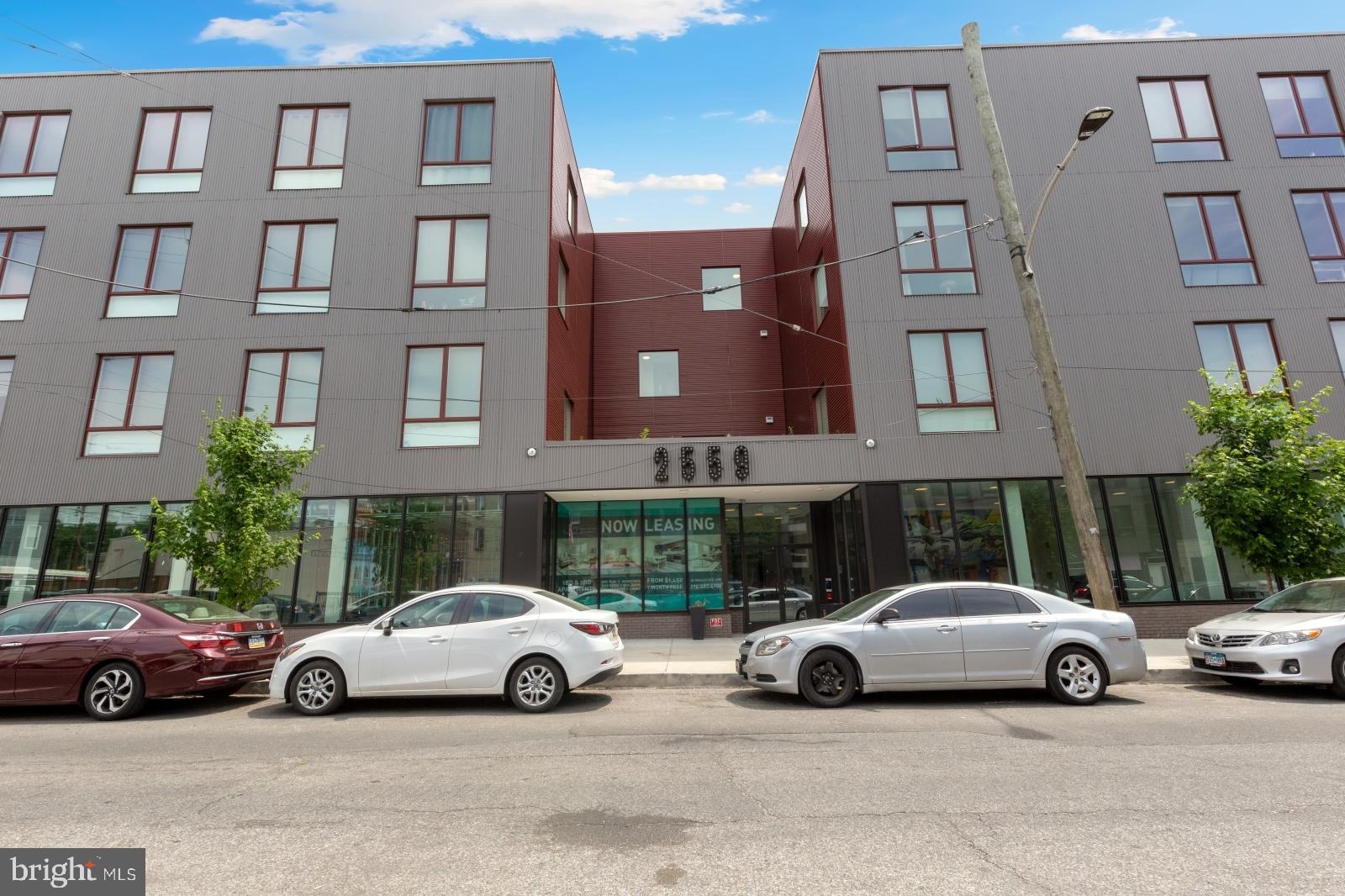 2559 Amber Street, Unit 101 Philadelphia, PA 19125 - Photo 31 of 35 a view of cars parked in front of a building