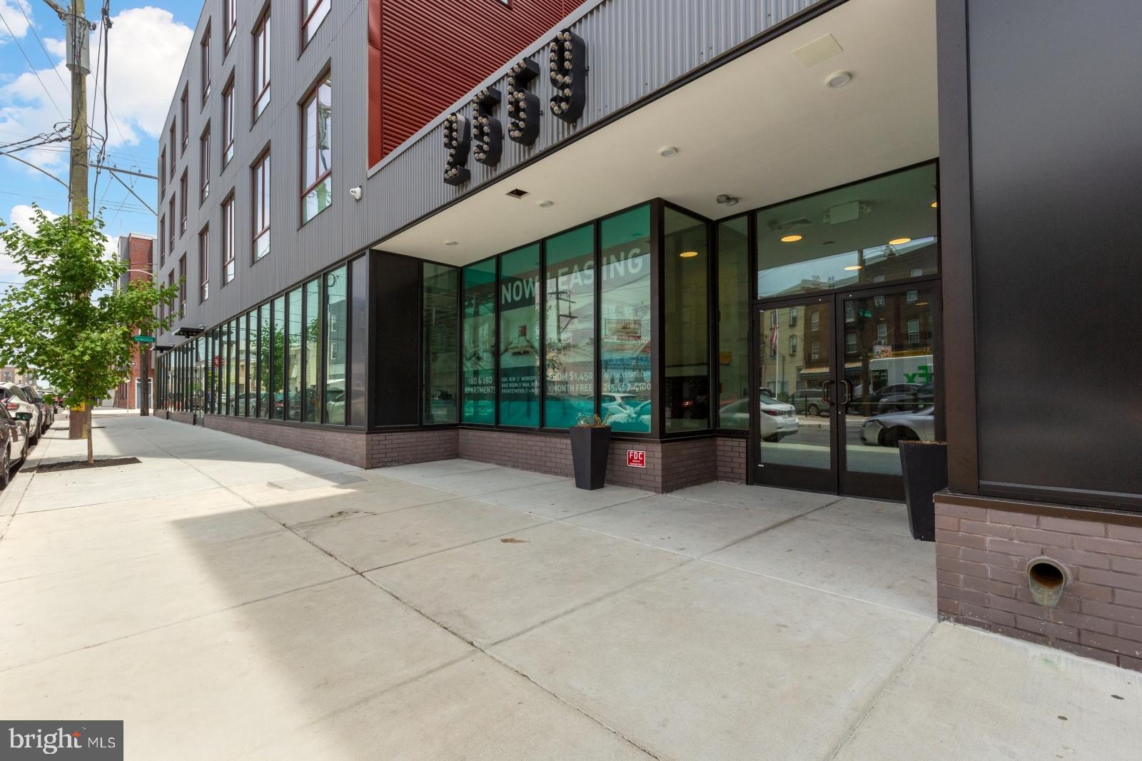 2559 Amber Street, Unit 101 Philadelphia, PA 19125 - Photo 32 of 35 a view of a building with glass door and porch