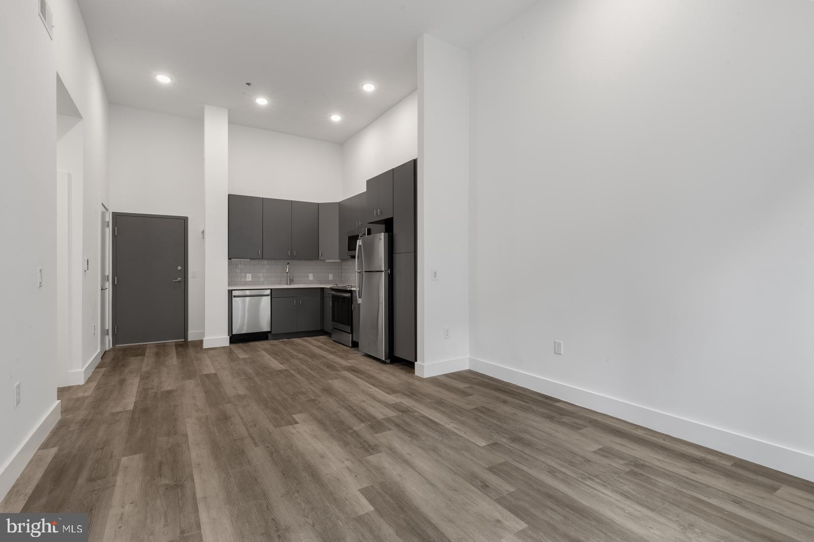 2559 Amber Street, Unit 101 Philadelphia, PA 19125 - Photo 5 of 35 a view of kitchen with refrigerator and window
