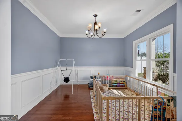 a bedroom with furniture and a window