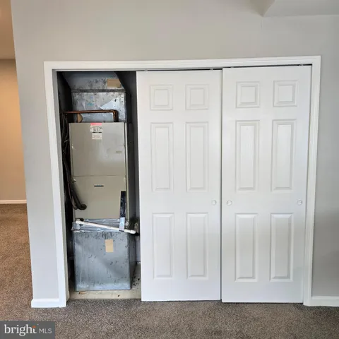 a kitchen with stainless steel appliances a refrigerator a stove a sink and a microwave