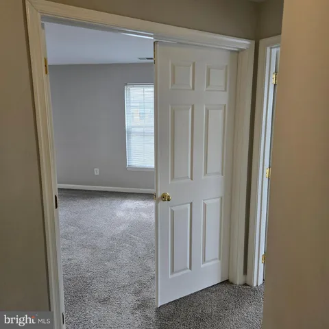 an empty room with closet area