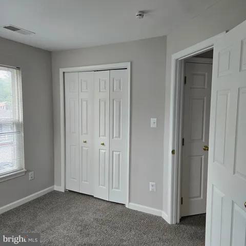a view of balcony with wooden floor