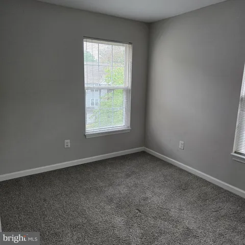 a view of a balcony with wooden floor