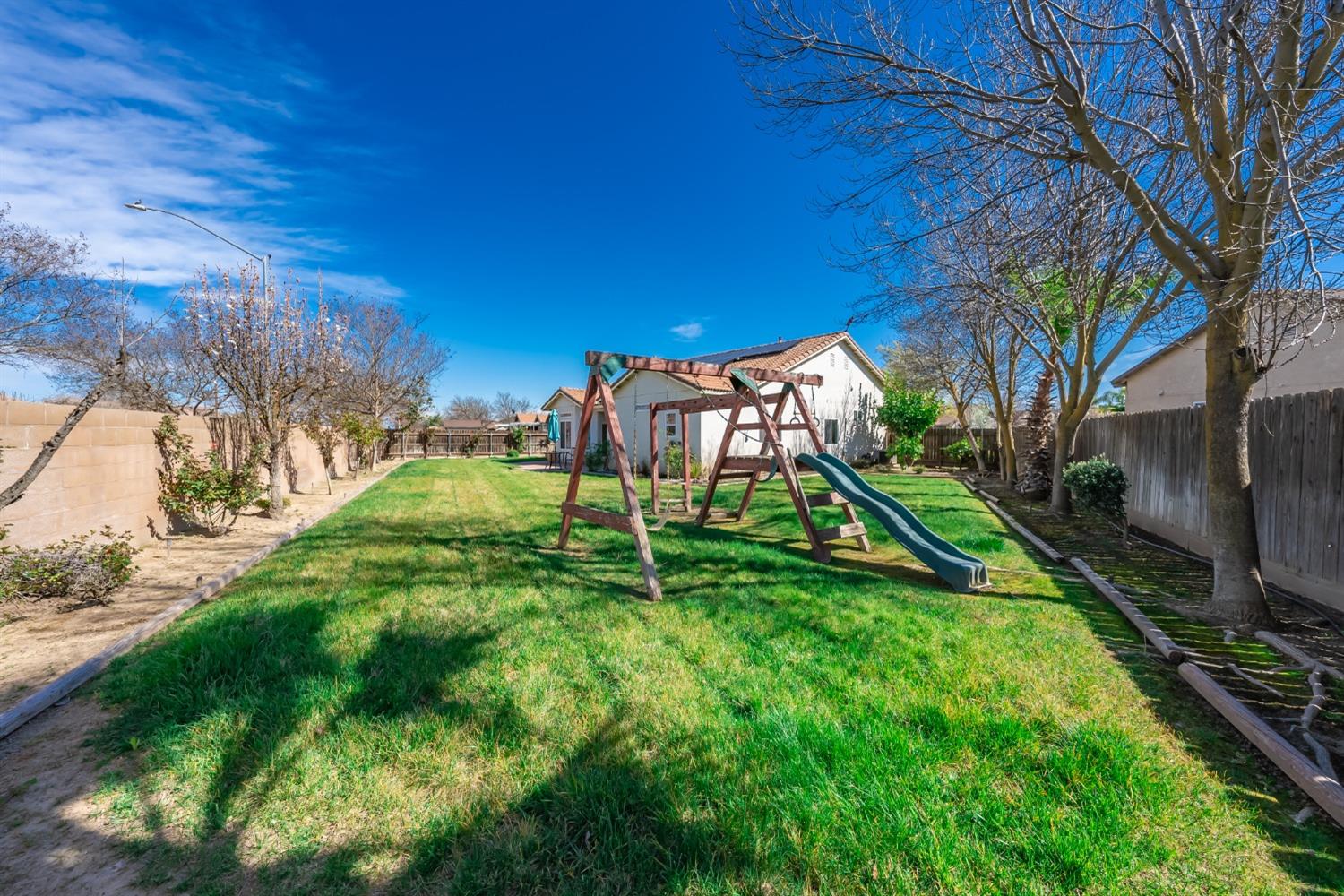 2727 Pear Tree Drive Madera, CA 93637 - Photo 27 of 36 a view of a park with iron fence