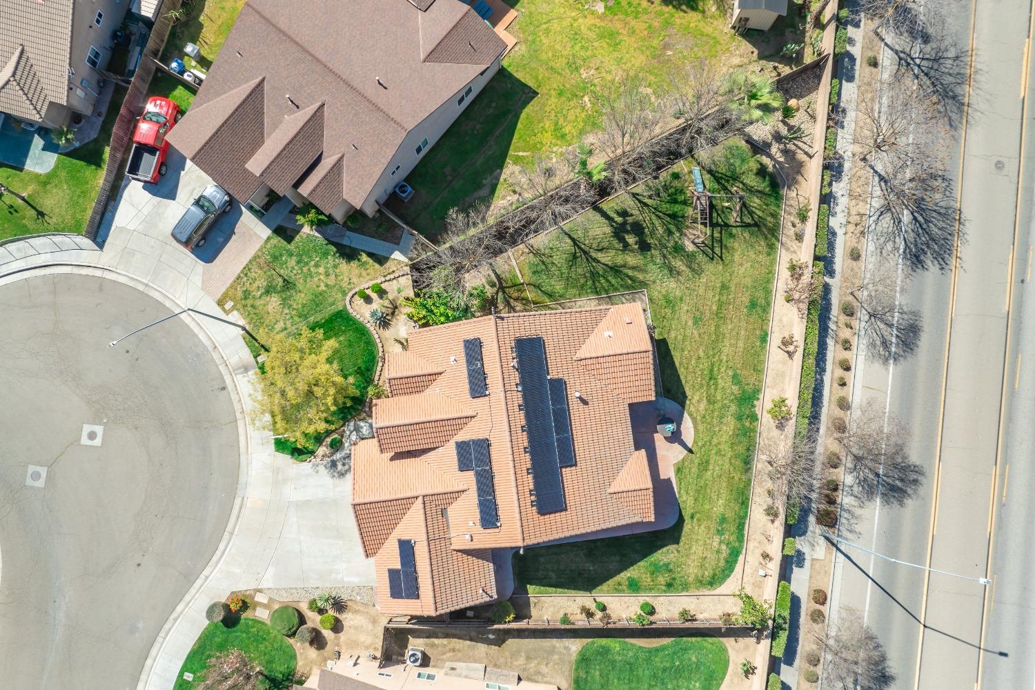 2727 Pear Tree Drive Madera, CA 93637 - Photo 32 of 36 an aerial view of a house with a yard and garden