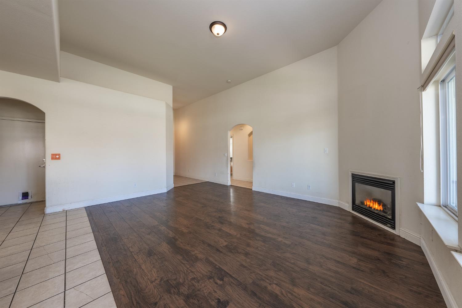 2727 Pear Tree Drive Madera, CA 93637 - Photo 7 of 36 a view of empty room with a fireplace