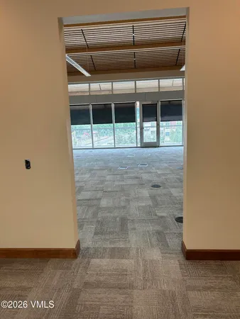 a view of empty room with windows