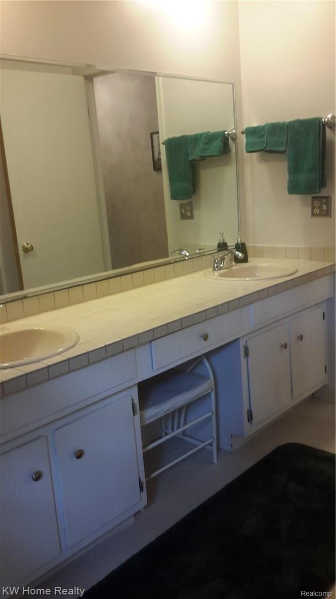 44711 Brookside Road Plymouth, MI 48170 - Photo 27 of 45 Ceramic tile counter in large upper level bath