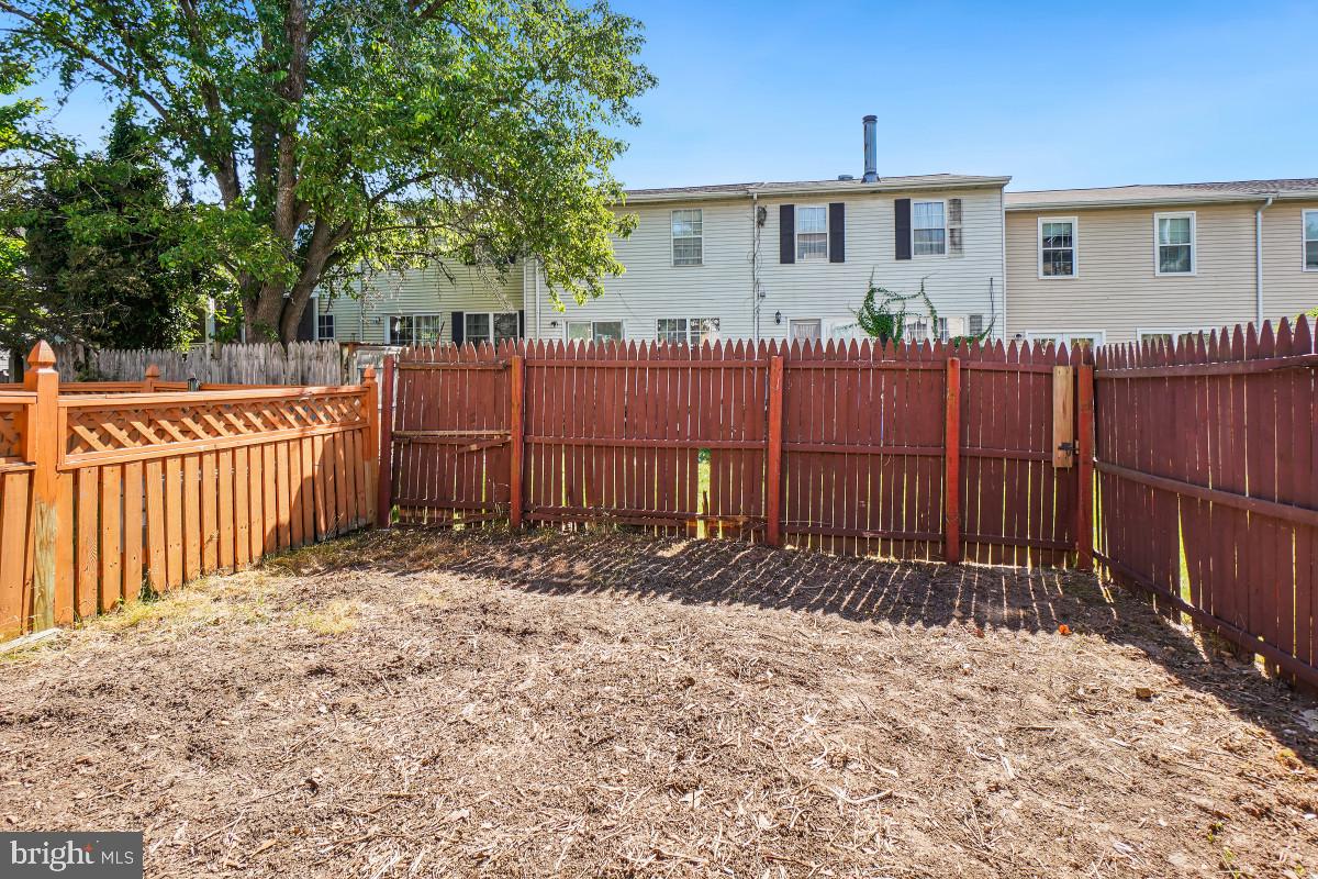 35 Bellfalls Way Nottingham, MD 21236 - Photo 29 of 30 a view of a house with a wooden fence