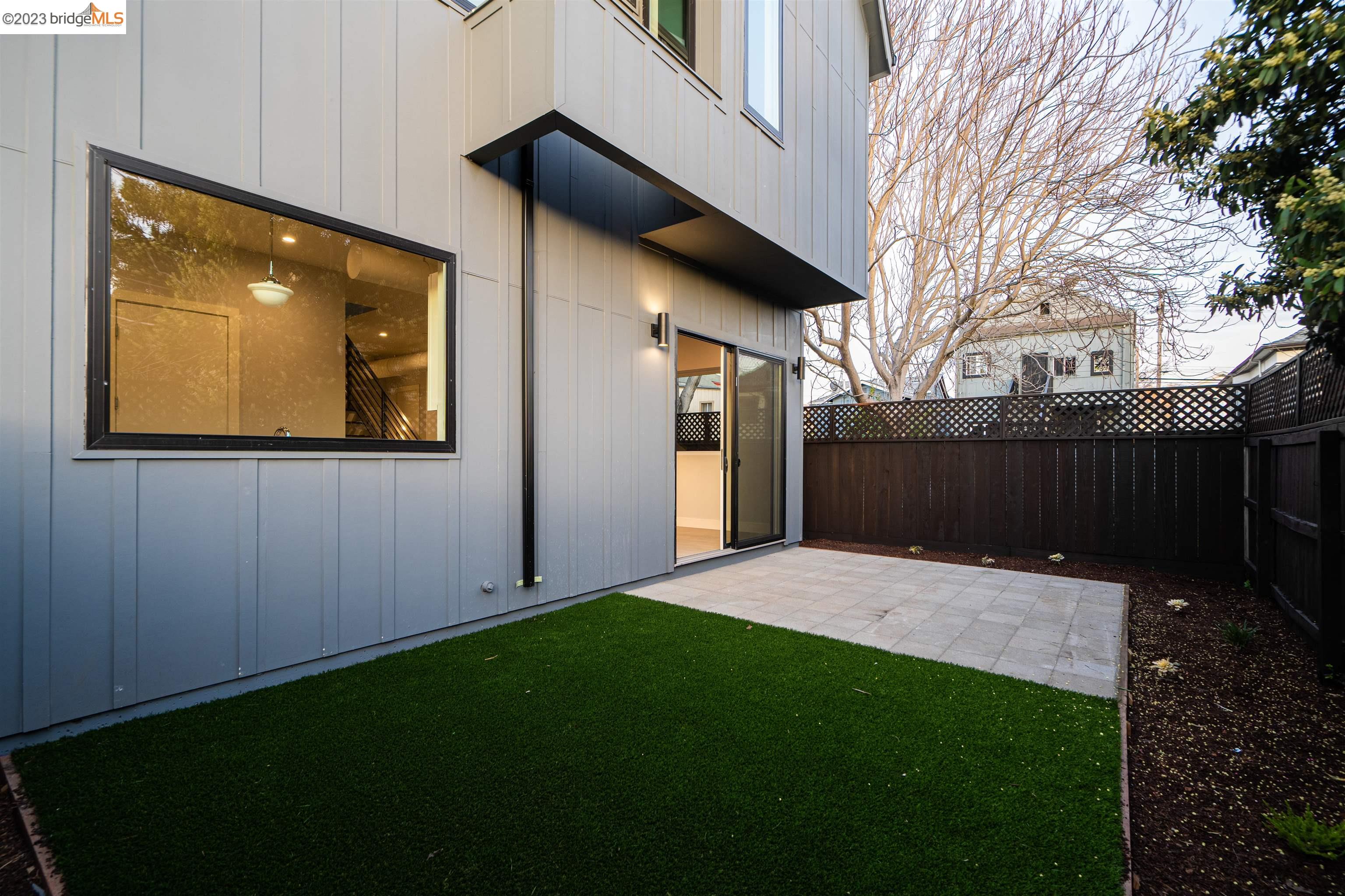 1677 12th Street Oakland, CA 94607 - Photo 14 of 15 a backyard of a house with lots of green space