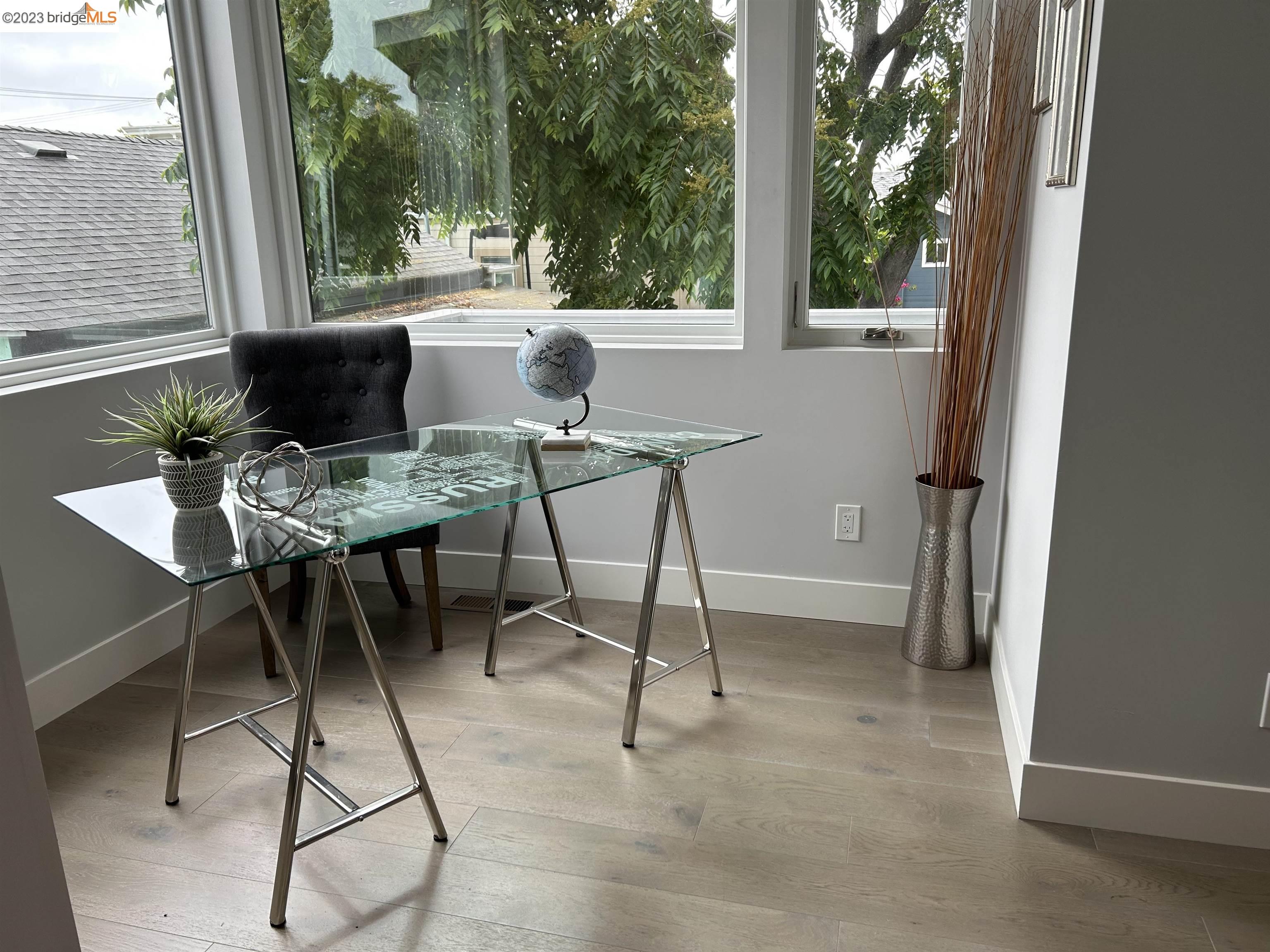 1677 12th Street Oakland, CA 94607 - Photo 4 of 15 a view of a dining room with furniture window and outside view
