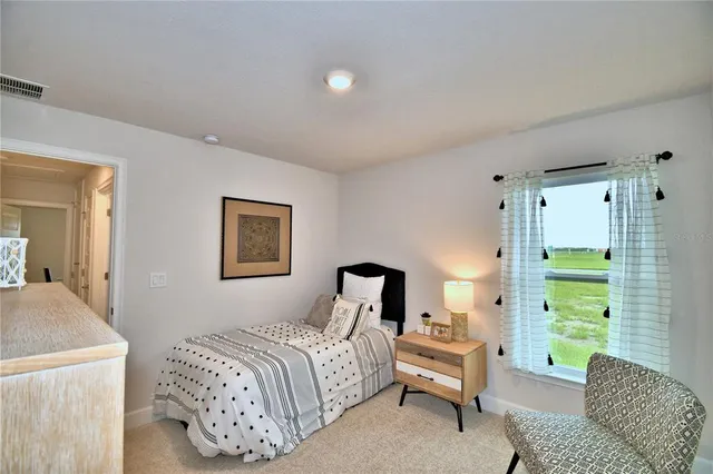 a bathroom with a granite countertop toilet sink and mirror