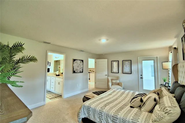 a bathroom with a granite countertop sink mirror and shower