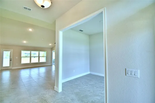a view of an empty room with a window