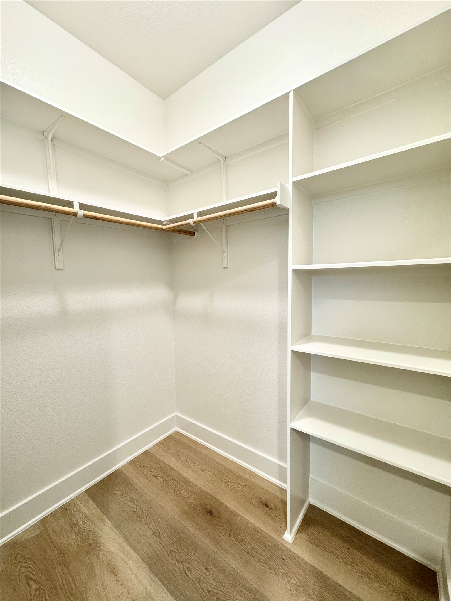 108 Zayd Court, Unit B Jarrell, TX 76537 - Photo 12 of 21 a view of walk in closet with empty racks
