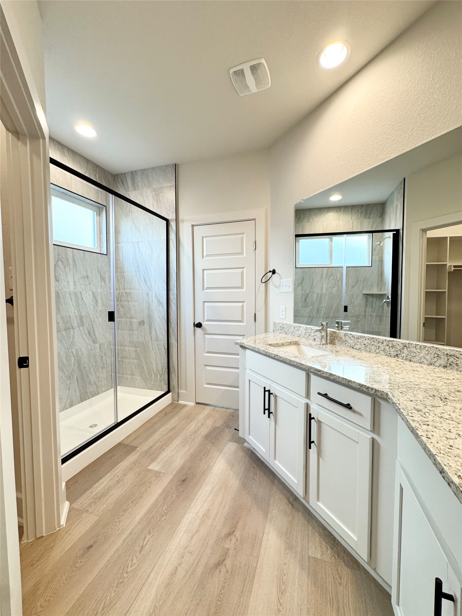 108 Zayd Court, Unit B Jarrell, TX 76537 - Photo 13 of 21 a bathroom with a granite countertop sink mirror and double