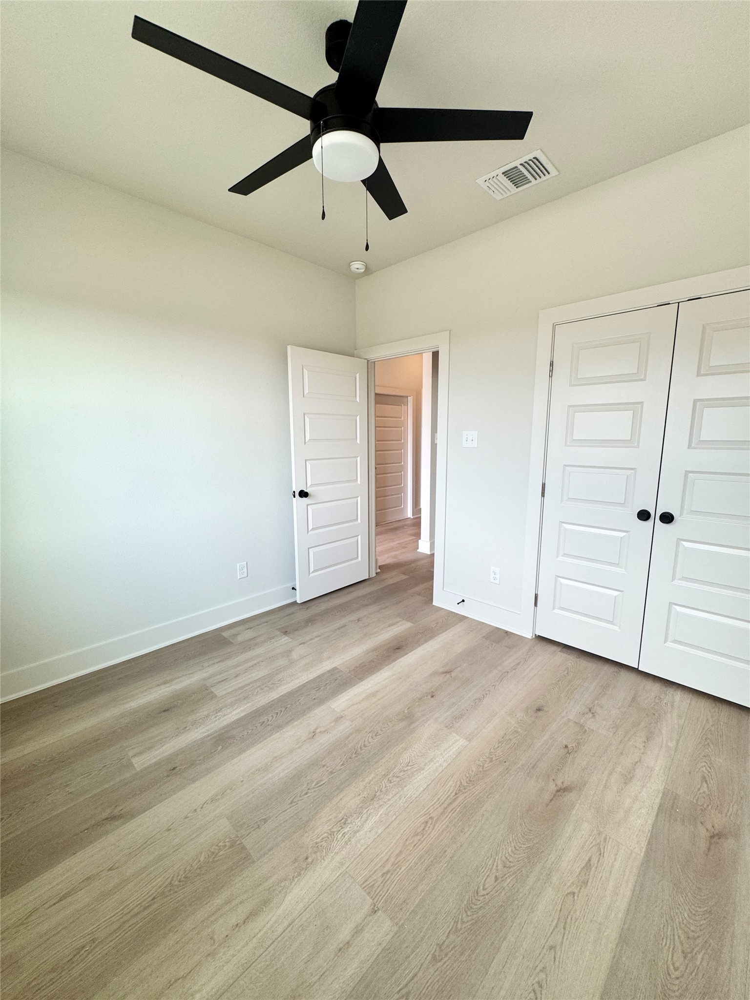 108 Zayd Court, Unit B Jarrell, TX 76537 - Photo 14 of 21 an empty room with ceiling fan and window