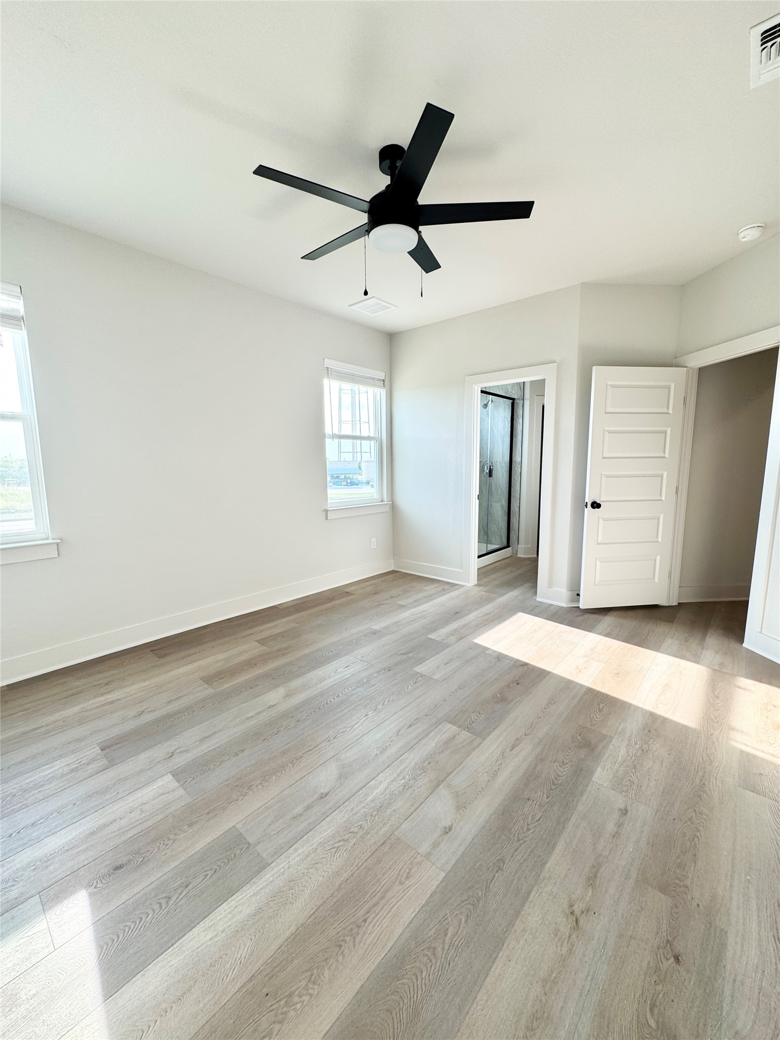 108 Zayd Court, Unit B Jarrell, TX 76537 - Photo 19 of 21 a view of empty room with wooden floor and window