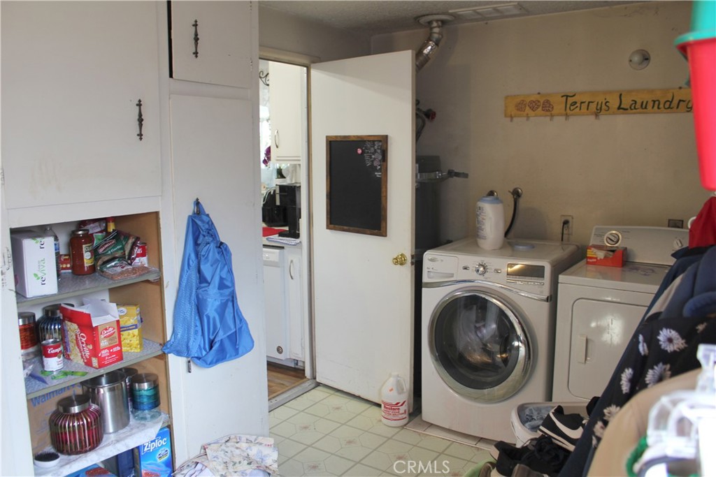 5911 Green Valley Road Riverside, CA 92504 - Photo 18 of 24 a view of a storage & utility room with washer and dryer