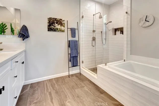 a bathroom with a bathtub and a shower
