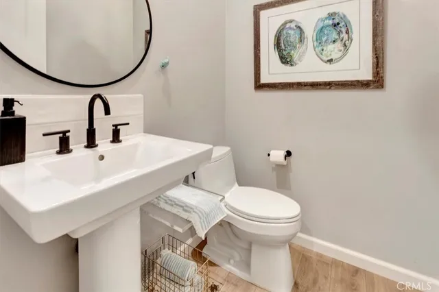a bathroom with a toilet and a sink