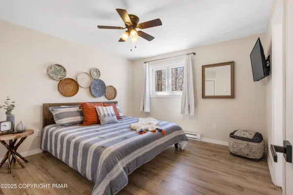 a bedroom with a bed and a chandelier