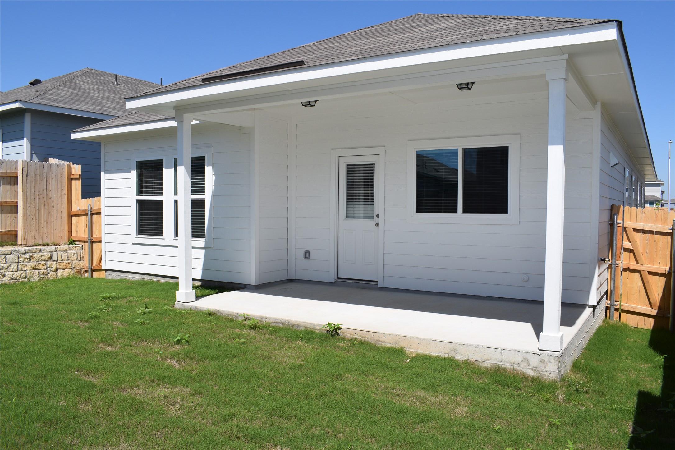 2705 Towy Road Manor, TX 78653 - Photo 22 of 30 Rear view of house with a patio area