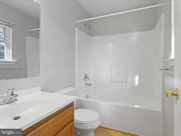 a bathroom with a sink a toilet and a bathtub