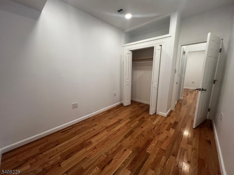 3 Montclair Avenue Paterson, NJ 07503 - Photo 11 of 17 a view of a room with wooden floor and a sink